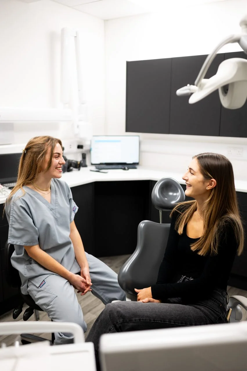 cardiff-dental-nurse-patient-consultation Dental nurse supporting a patient during a consultation in the surgery at Cardiff Dental